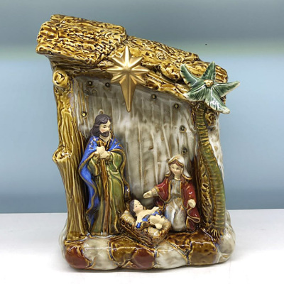 Ceramic artwork with nativity manager with lamp Christian who relics