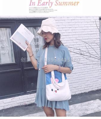 The new 2018 canvas bag is a one-shoulder Japanese cartoon ear-stick canvas bag for women