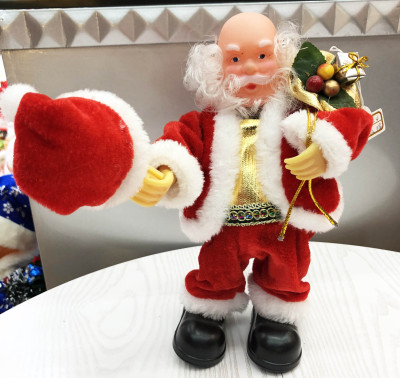 Dancing Santa with a height of 23cm, swinging a hat
