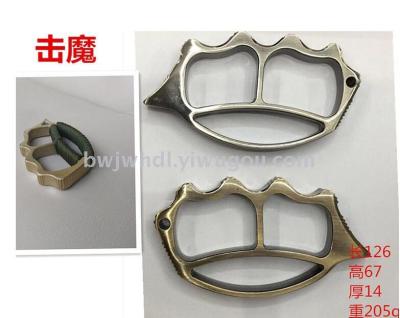 Wholesale tiger iron four finger fist buckle fitness tools military fan supplies to hit the magic gun bronze color