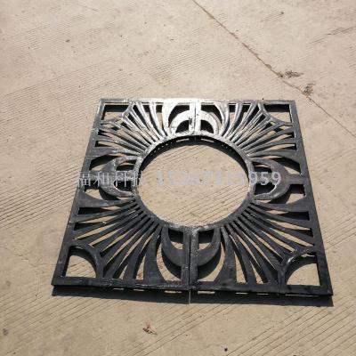 Cast iron grate with cast iron manhole cover