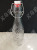 2019 new sealed bottle with iron buckle cactus style horizontal grain glass iron buckle bottle