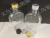 Manufacturers direct flat square glass bottle glass beverage bottle multi-color cover (black, gold, silver)