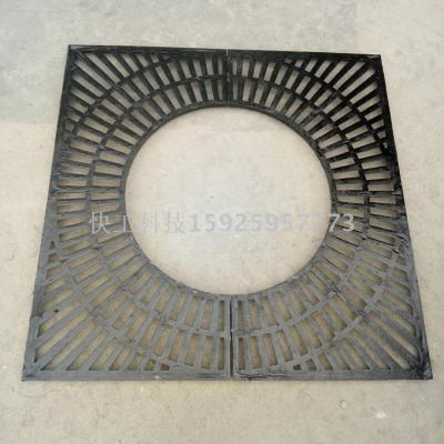 Cast iron grate with manhole cover