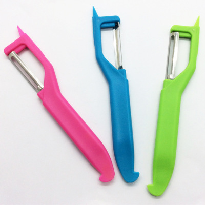 Plastic melon planer with pointed peeler. Stainless steel blade, candy peeler