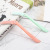 Two collapsible fashion eyebrow trimmers carry removable head and blade trim cosmetic tools