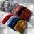 The new knitted hat is pure color double layer knitted cold hat