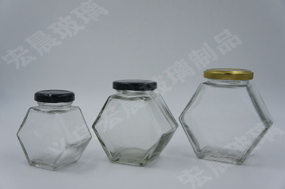 Manufacturers direct selling wire mouth glass honey bottle honeycomb hexagonal series glass honey bottle multi-capacity