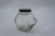 Manufacturers direct selling wire mouth glass honey bottle honeycomb hexagonal series glass honey bottle tinplate cover