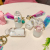 Douyin web celebrity floating milk mouse children cute liquid pendant key quicksand drift bottle into the oil bag hanging