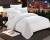 Pure white cotton bed in a four-piece hotel suite