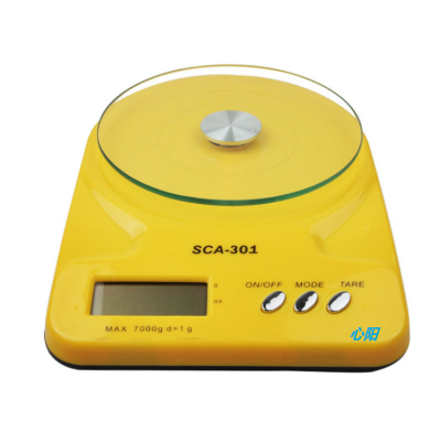 Candy-colored electronic scale for home use in the kitchen for baking