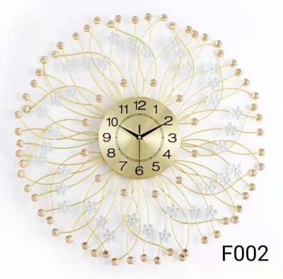 Stylish modern simple Korean version of tieyi wall clock quiet living room technology clock factory foreign trade peacock wall clock metal face