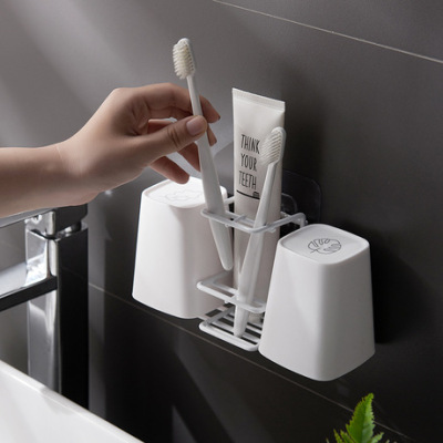 The Metal creative toothbrush holder, suction wall bathroom traceless bathroom wall toothpaste rack bathroom rack manufacturers