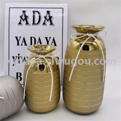 Ceramic vase frosted string flower arrangement with gold and silver plated across the throat