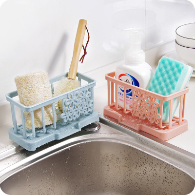 Sink mesa is clean dishcloth to wear plastic to drain water to wear sponge to receive buy thing to wear 100 clean cloth to hang rack