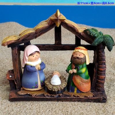 A family in A manger, the birthplace of Jesus, Presents Religious figures in sand and Catholic Church