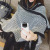 South Korean version of hooded tassel cape new autumn winter black and white diamond oversize versatile thick shawl knit coat women