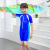 Children's one-piece swimsuit in nylon monochrome, short sleeve, flat Angle, for children's wetsuit with cap, available in 4 sizes from manufacturers