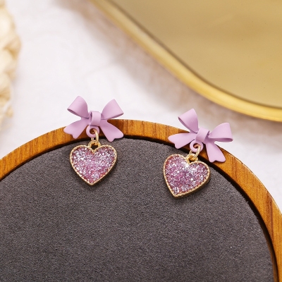 S925 Silver Bow earrings with pink and purple heart sequins and lovely little oil drops