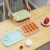 A portable storage box for kitchen refrigerators with 20 compartments of multifunctional egg tupperware