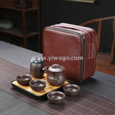 Carry a purple clay teapot a tea cup a teapot a traveling teapot a ceramic pot a kung fu tea canister