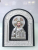 A plastic three-dimensional image of a religious image framed by a doorpost of the Russian Orthodox Church