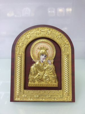 A plastic three-dimensional image of a religious image framed by a doorpost of the Russian Orthodox Church