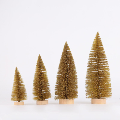 Christmas table tops are decorated with golden pine needles and mini Christmas trees dusted with powder