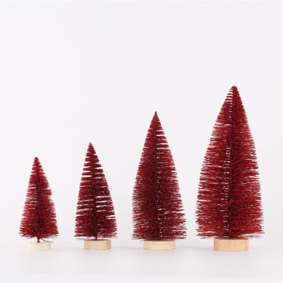 Christmas table tops are decorated with red pine needles and mini Christmas trees dusted with powder