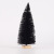 Christmas table tops are decorated with black pine needles and mini Christmas trees dusted with powder