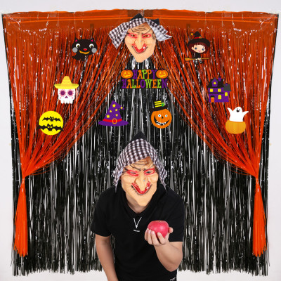 Halloween party decorated with white black orange rain curtain background wall witch mask pull flag tassel curtain