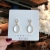 Internet Influencer Cold Style Super Fairy Simple Earrings Sense of Quality Fashion White Moonlight Cat's Eye Earrings
