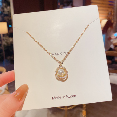 Korean Style Personalized Titanium Steel Necklace Women's Fashion Dignified Hollow Bird's Nest Bright Pearl Pendant High Sense Necklace Wholesale