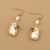 European and American Design Handmade Winding Imitation Pearl Earrings Fashion Popular Long Tassel Butterfly Flower Earrings for Women Ins