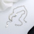 Chaosheng S925 Sterling Silver INSS Splicing Love Pearl Angel Wings Tassel Necklace French Entry Lux Temperament Female