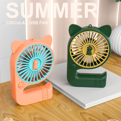 Factory Direct Sales 2022 New Product Creative Curved Luminous Hand Fan USB Rechargeable Small Fan Dinosaur Fan