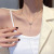 Long Fringed Zircon Bow Titanium Steel Necklace Women's Fashion Simple Design Clavicle Chain Cold Wind Net Red Pendant