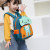 2022 New Korean Style Primary School Student Schoolbag Waterproof Large Capacity Burden Reduction Spine Protection Breathable and Wearable Children Backpack