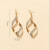 European and American Fashion Cool Simple Texture Frosted Iron Spiral Pendant Earrings Wholesale
