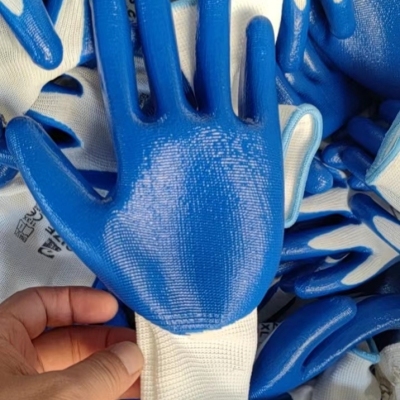 Shandong Gaomi Factory Direct Sales: Thirteen Needle Nylon White Yarn Blue Tape Tab Nitrile Labor Protection Work Gloves
