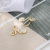 Japanese and Korean Simplicity Fashion Hoop Spell Sun Wukong Ear Clip Korean Flower Shape Non-Piercing Earrings Single Price
