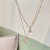 New Sweet Cool Double-Layer Pearl Clavicle Necklace Women's Japanese and Korean Fashion Elegant Heart Cat Eye Design Niche Necklace Fashion