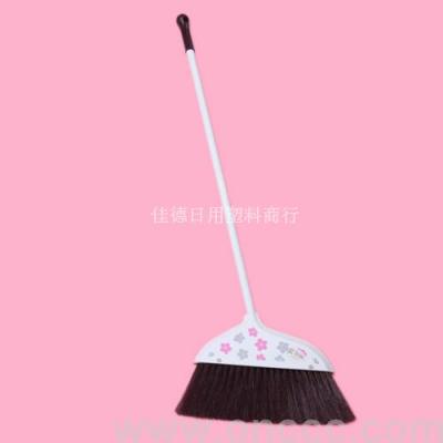 The printed broom sweeps the plastic.