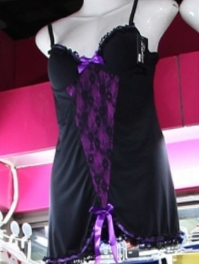 Black and purple lady's gown with suspenders