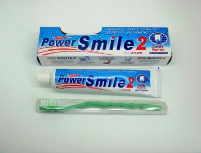 power smile 2 brand fluoride toothpaste with toothbrush