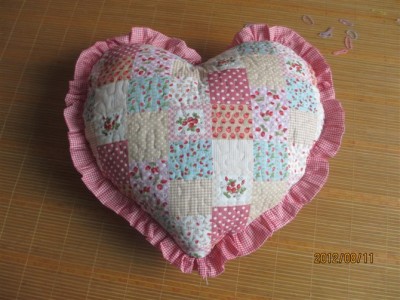 The love cushion pillow holds the quilt quilting material.
