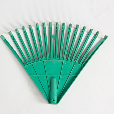 Plastic grass harrow garden rake.