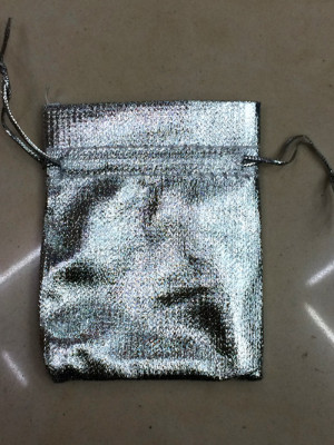 A silver cloth bag A bag of jewelry