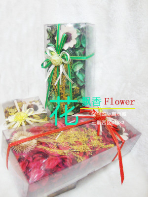 The PVC box containing dried flowers and other decorative woodchip flowers